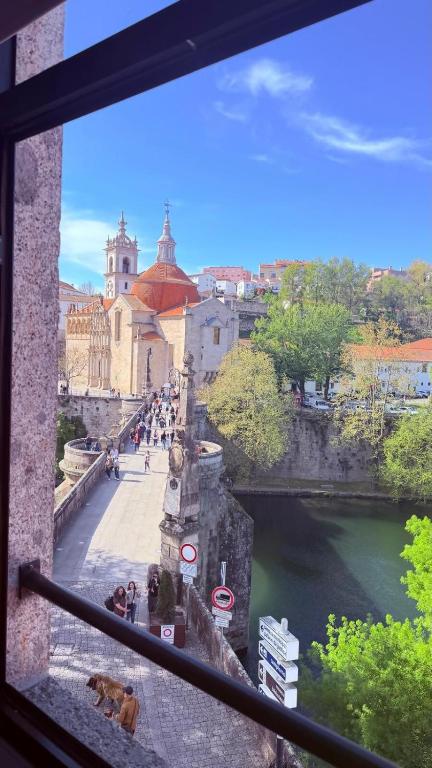 a view from a window of a bridge over a river at Casa Ponte de São Gonçalo in Amarante