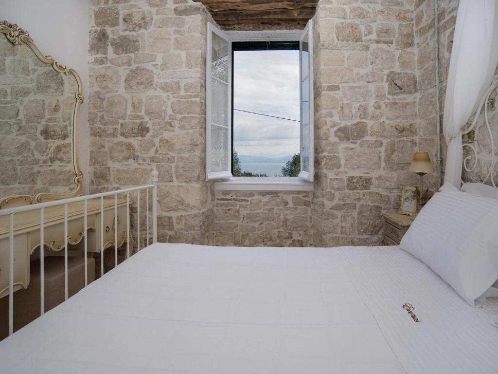 Postel nebo postele na pokoji v ubytování Villa Eleonas