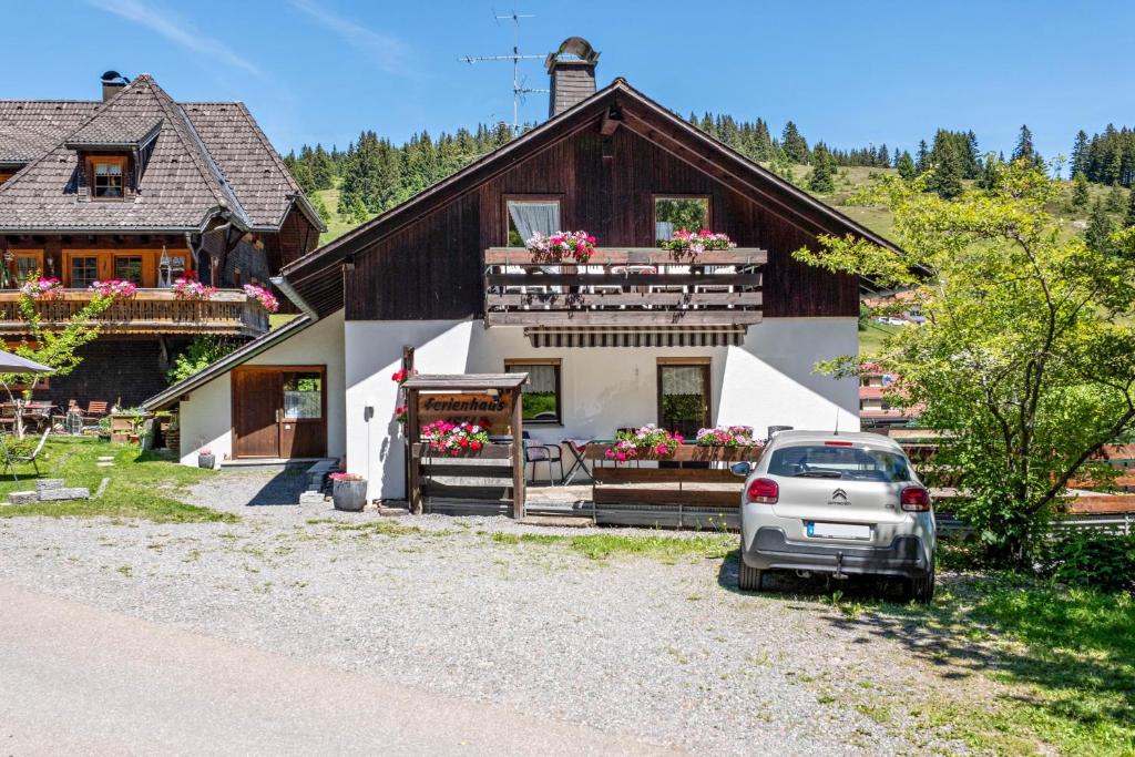 a car parked in front of a house at Ferienhaus Isele in Feldberg