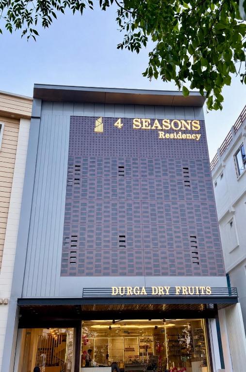 a store front of a building with a sign on it at 4 Seasons Residency in Katra