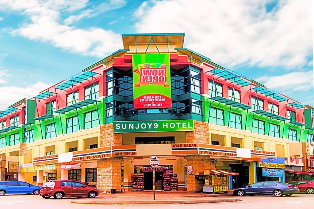 a building with a sign on the front of it at Hotel Sunjoy9 Bandar Sunway in Petaling Jaya