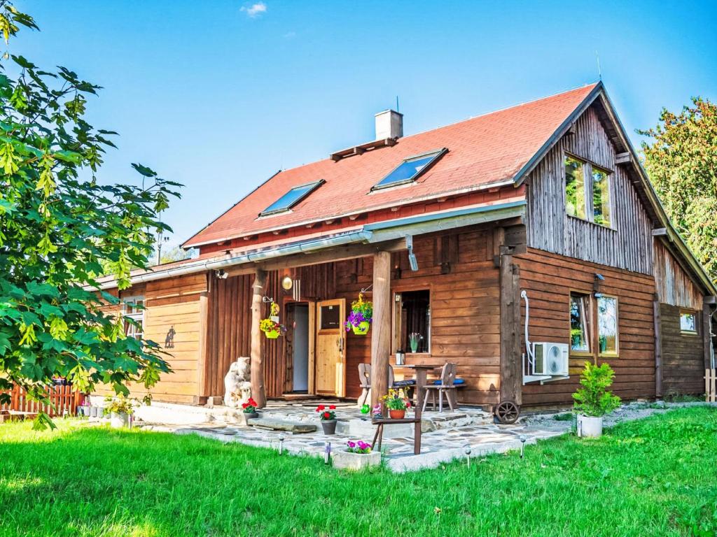 a wooden house with a red roof at Chalet Chata Ujo by Interhome in Hranice