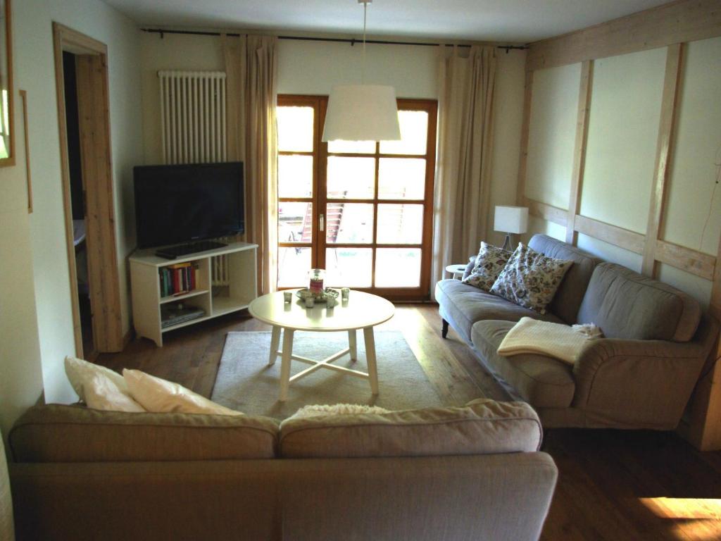 a living room with a couch and a table at Apartment Waldblick by Interhome in Bleckede