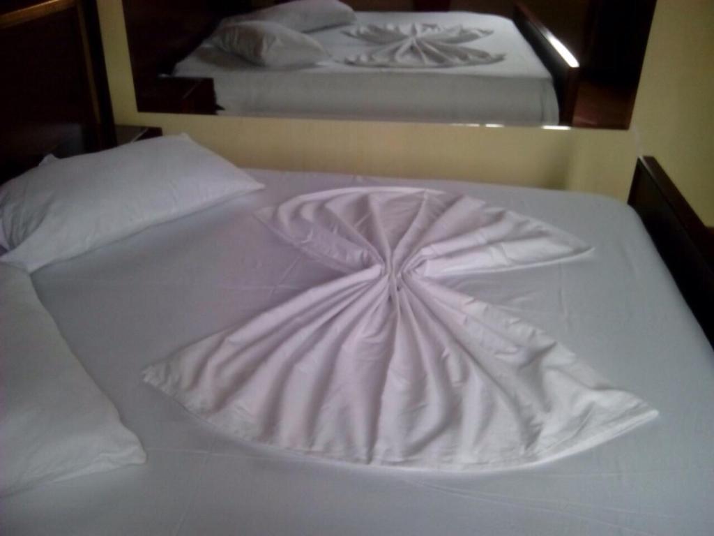 Postel nebo postele na pokoji v ubytování Hotel Deja