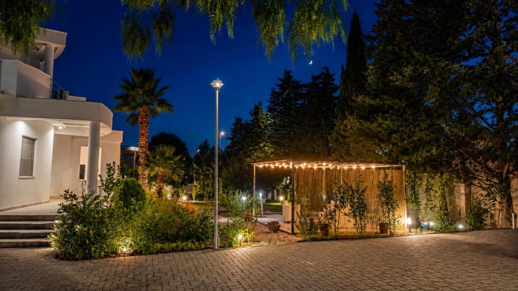 a tent with lights in a courtyard at night at Boat dreams , garden relax in Matino