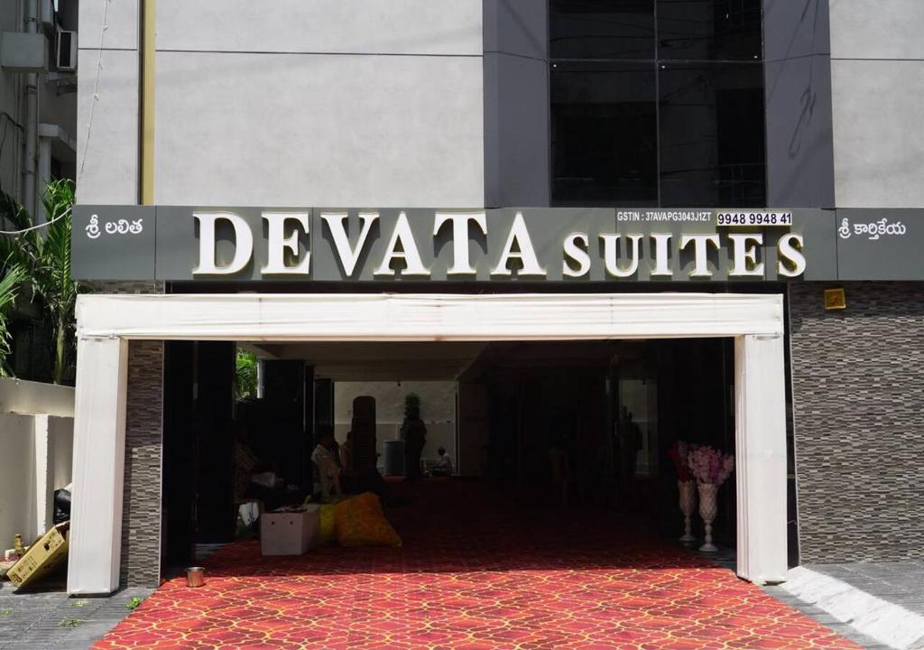 a building with a sign that reads devaza suites at DEVATA SUITES in Vijayawāda