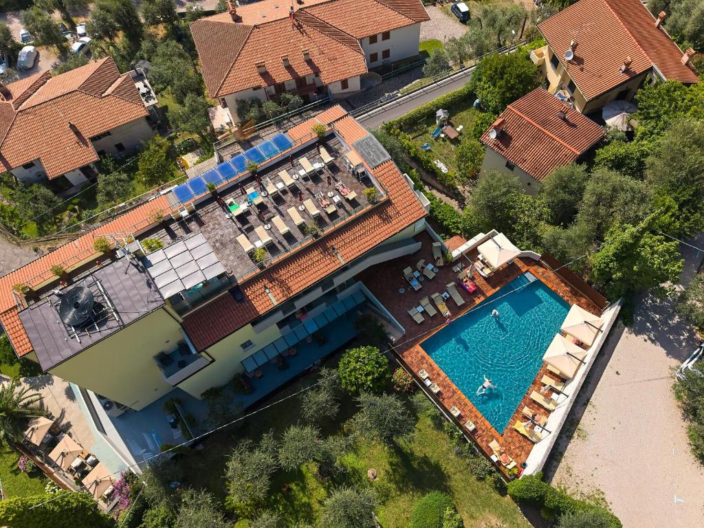 an overhead view of a large house with a swimming pool at Hotel Villa Smeralda in Malcesine