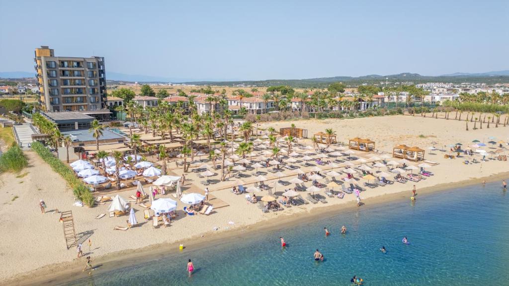 an aerial view of a beach with people and umbrellas at Ayvalık Sea Long in Ayvalık