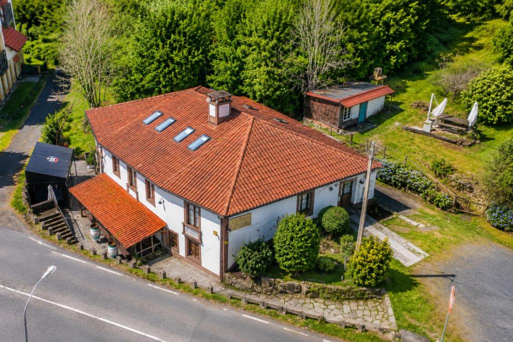 an overhead view of a house with an orange roof at Airtegal Casa do Puntal in Valdoviño