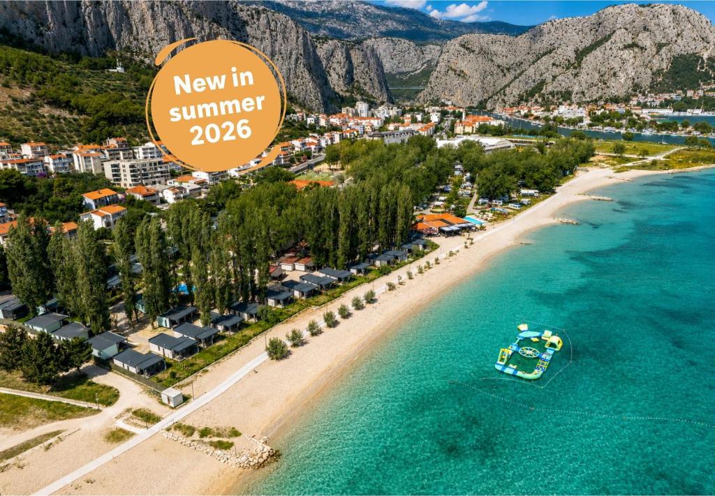 a new in summer sign on a beach at Camping Almissa in Omiš