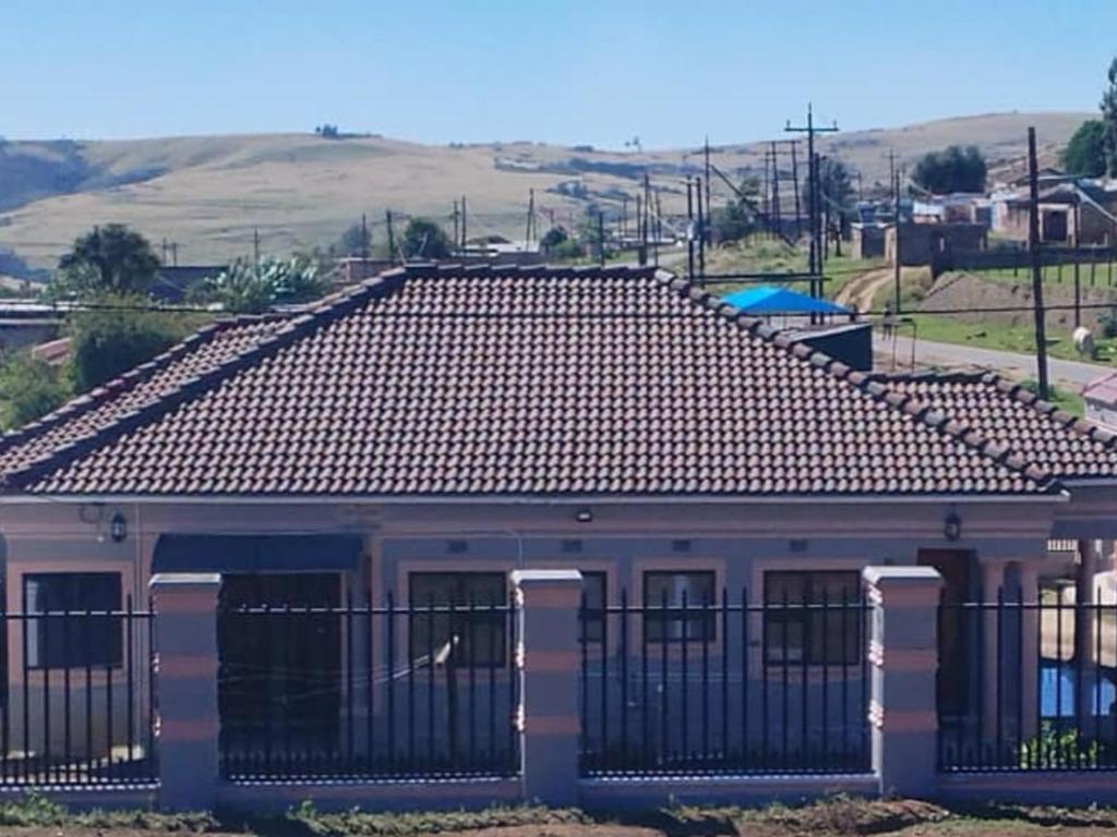 a roof of a building with a fence at Zamdu Lodge in Nkandla