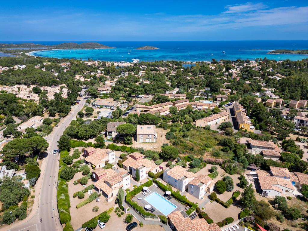 an aerial view of a town with houses and the ocean at Casa Mia in Porto-Vecchio