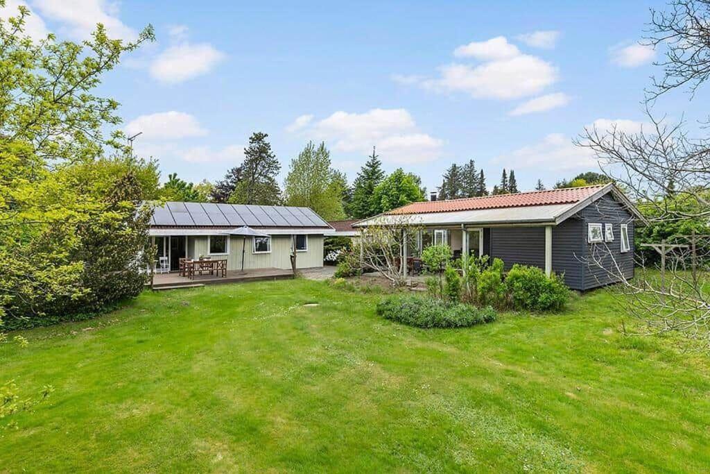 a home with a yard with a house at 588-N-Hundested-Krusemyntestien-5 in Hundested