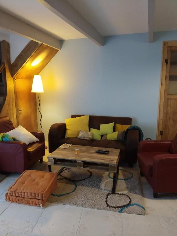 a living room with a couch and a coffee table at Village house 8 beds in Joncels
