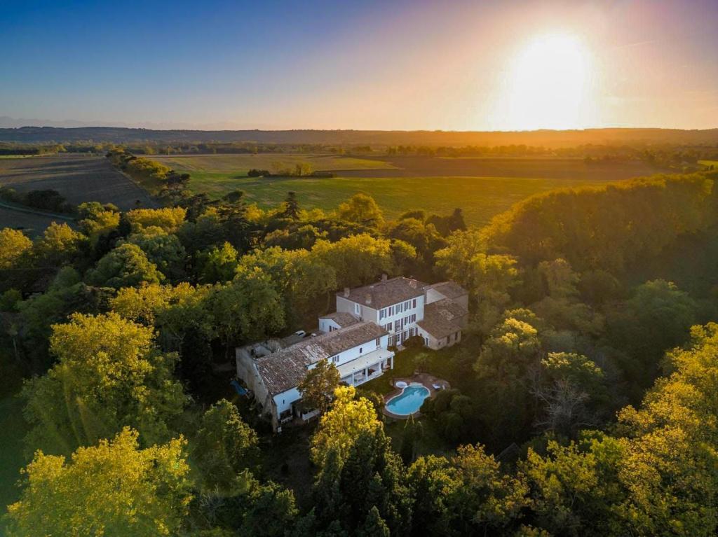 an aerial view of a house in the trees at Château de Lavail in Labastide-dʼAnjou