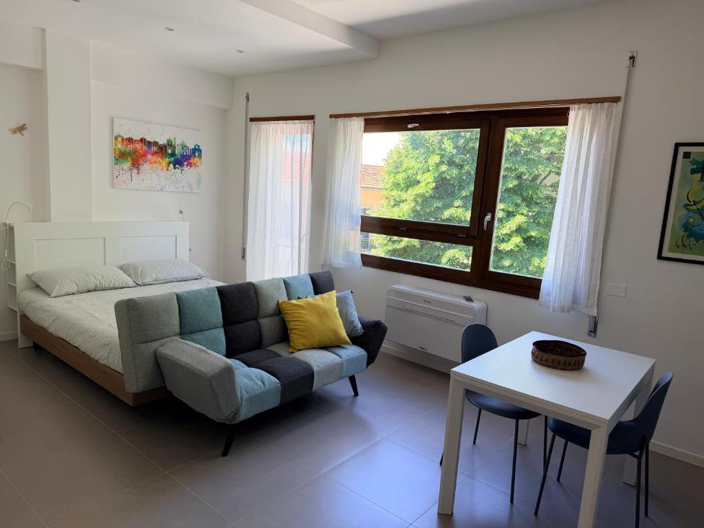 a living room with a couch and a table at Casa Pallacorda in Prato