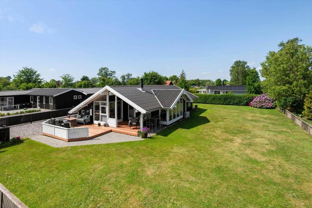 a house with a large yard in front of it at 30510-Odder-Elmegaardsvej-8 in Odder