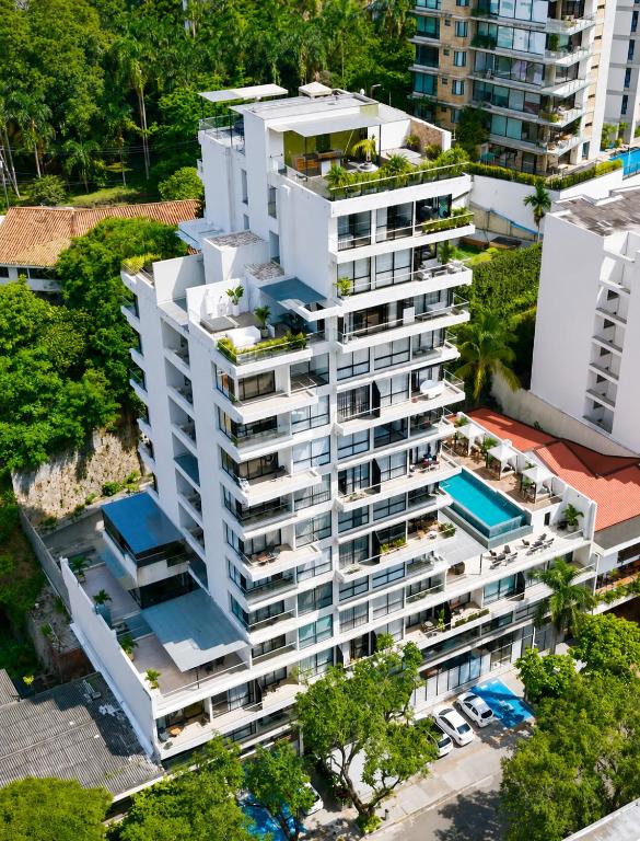 an overhead view of a white apartment building with balconies at Riomaggiore City Tower in Cali