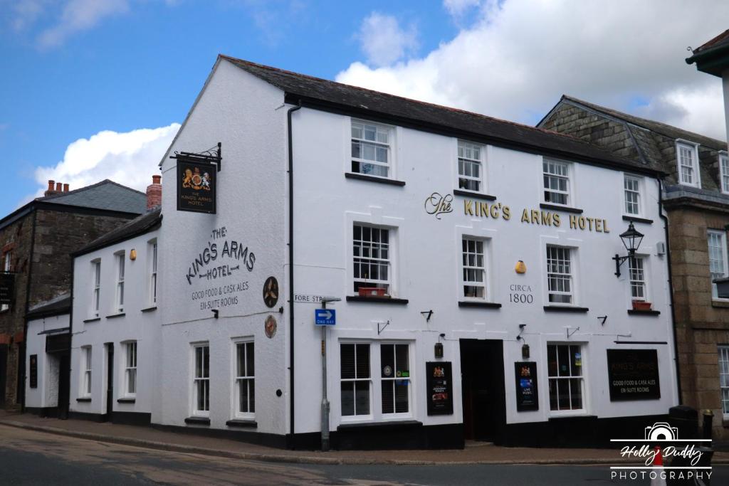 a white building on the side of a street at The Kings Arms Hotel, Lostwithiel in Lostwithiel