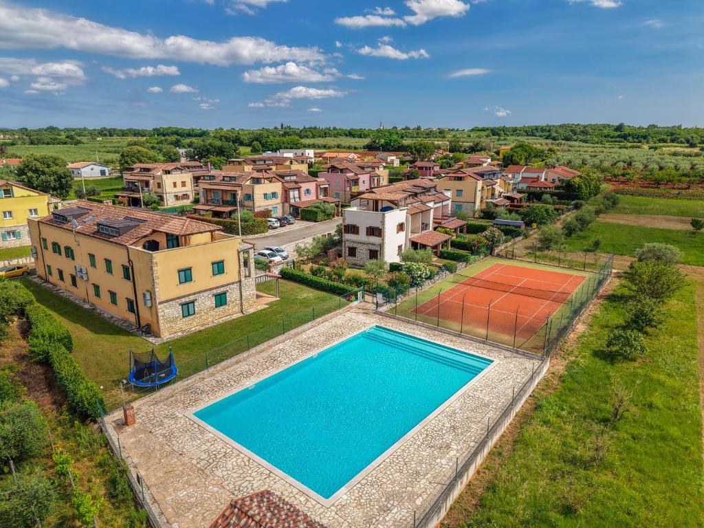 an aerial view of a house with a swimming pool at Gina Gedici Resort in Gedići