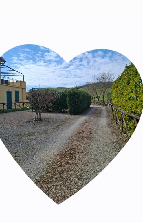 a heart shaped picture of a gravel road at La Nostra Maremma in Marsiliana