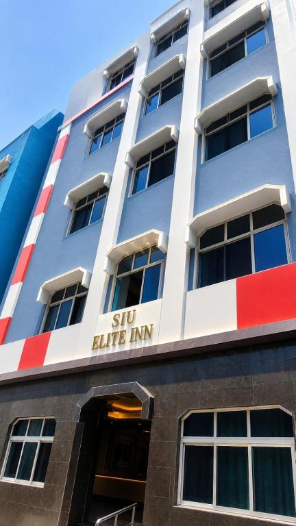 a building with the sign for the subway bite inn at SIU Elite INN in Chennai