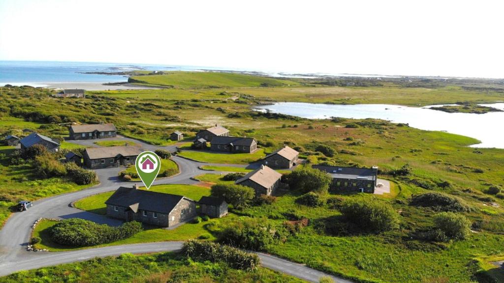 an aerial view of a house with a street sign at Murlach Moorings in Ballyconneely