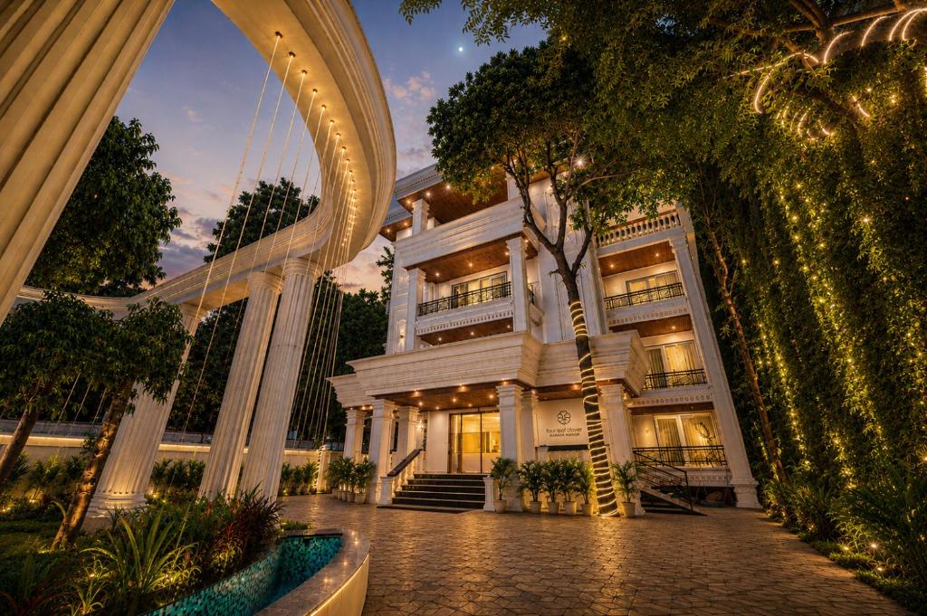a rendering of a building at night at Four Leaf Hotel Arjuna Manor, Varanasi in Varanasi