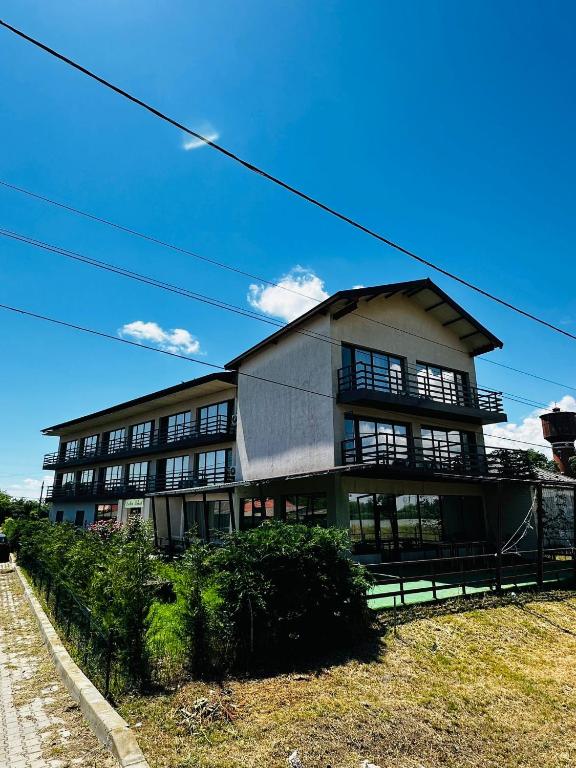 a large building on the side of a road at pensiunea delta ideal in Sulina