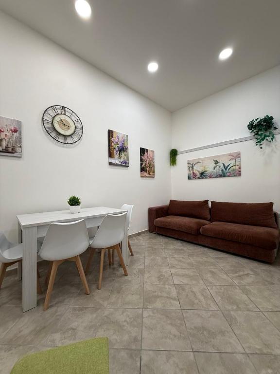 a living room with a couch and a table at Da Silvi Apartment in Terracina