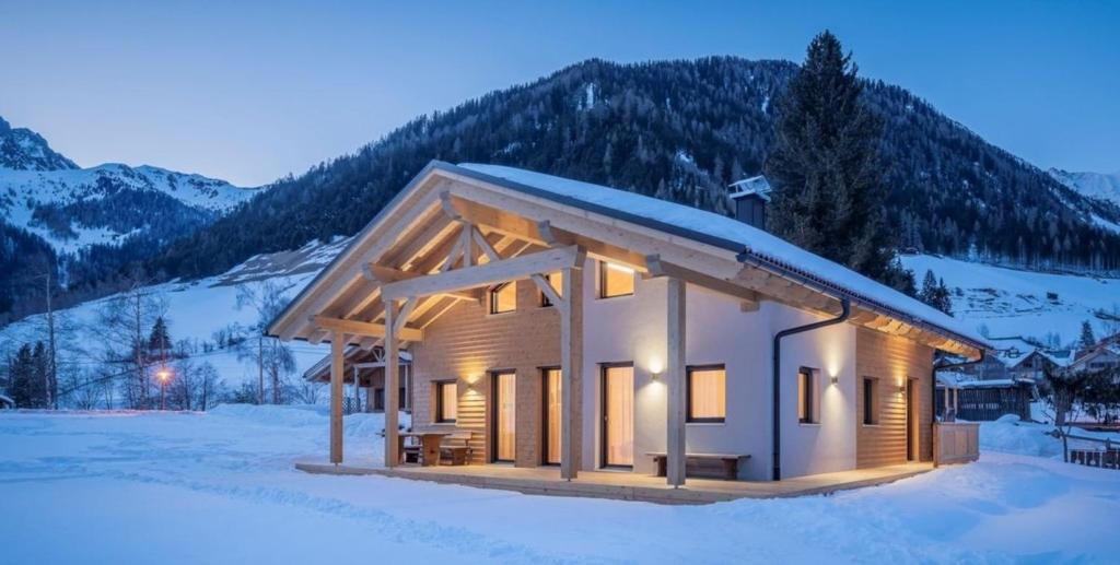 a cabin in the snow in the mountains at Chalet am Zirm in Riobianco