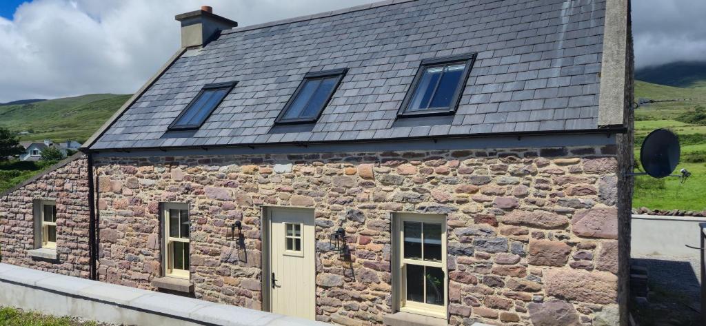 a stone building with windows and a roof at Kittys Haven in Castlemaine
