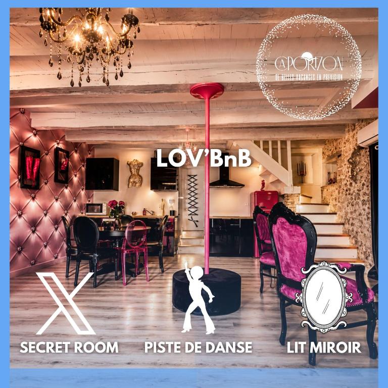 a room with a table and chairs and a chandelier at Caporizon-Lov'BNB-La seule Love House de Dordogne in Biras