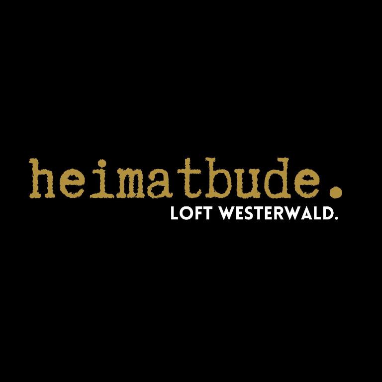 ein Schild mit der Aufschrift heinahlride lotwelicked in der Unterkunft heimatbude Loft in Rotenhain