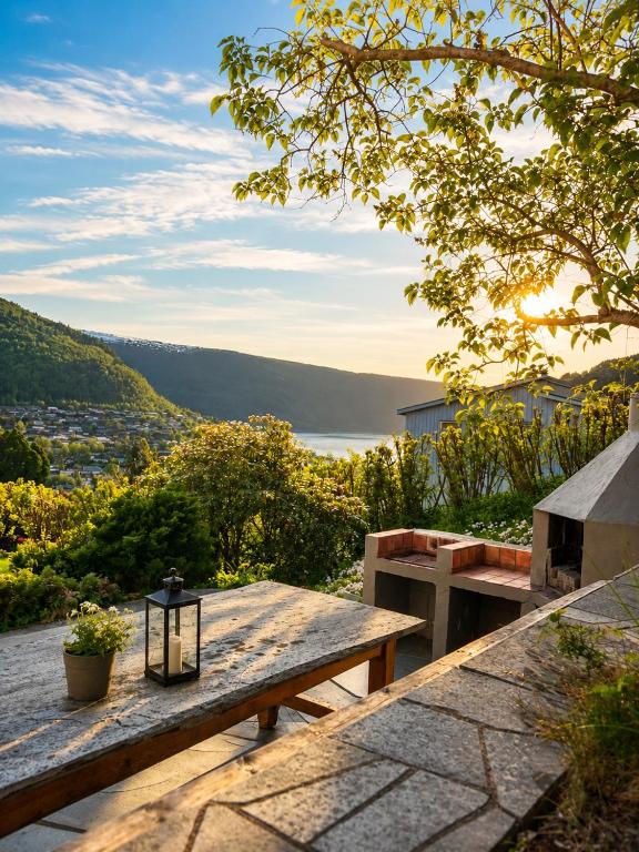 a picnic table with a view of a lake at Stryn Panorama in Stryn