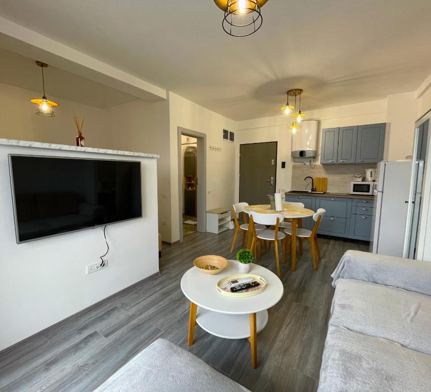 a living room with a couch and a table at Casa Mihuț in Cordău