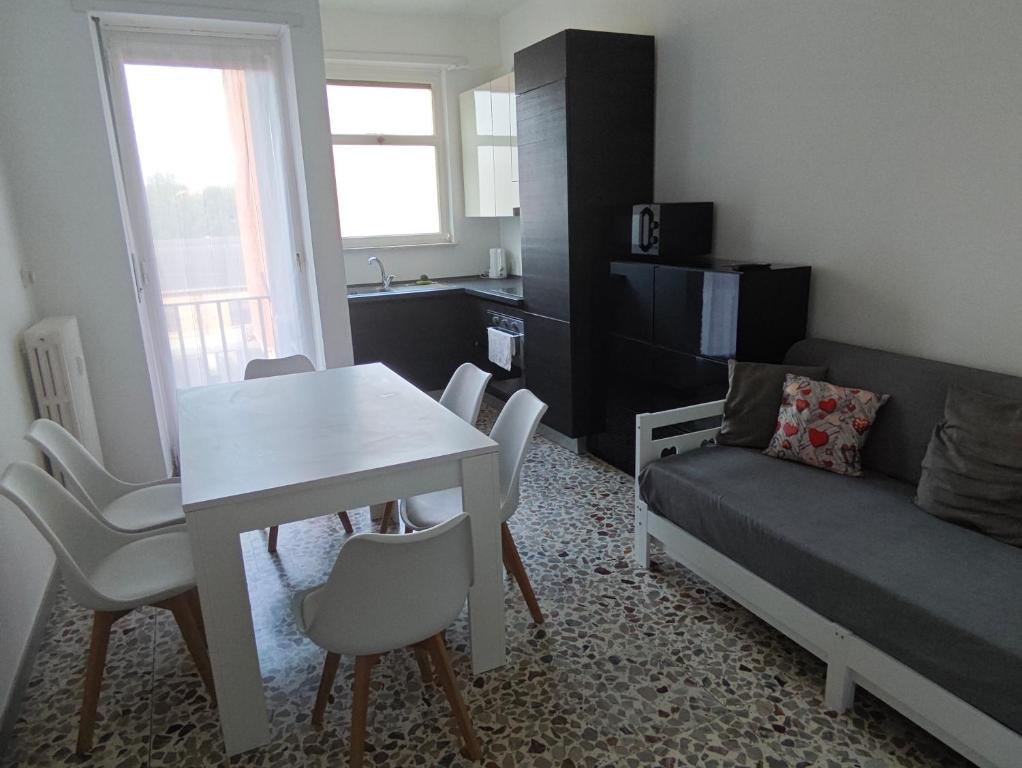 a small living room with a table and a couch at Torino Cozy Lodge in Turin