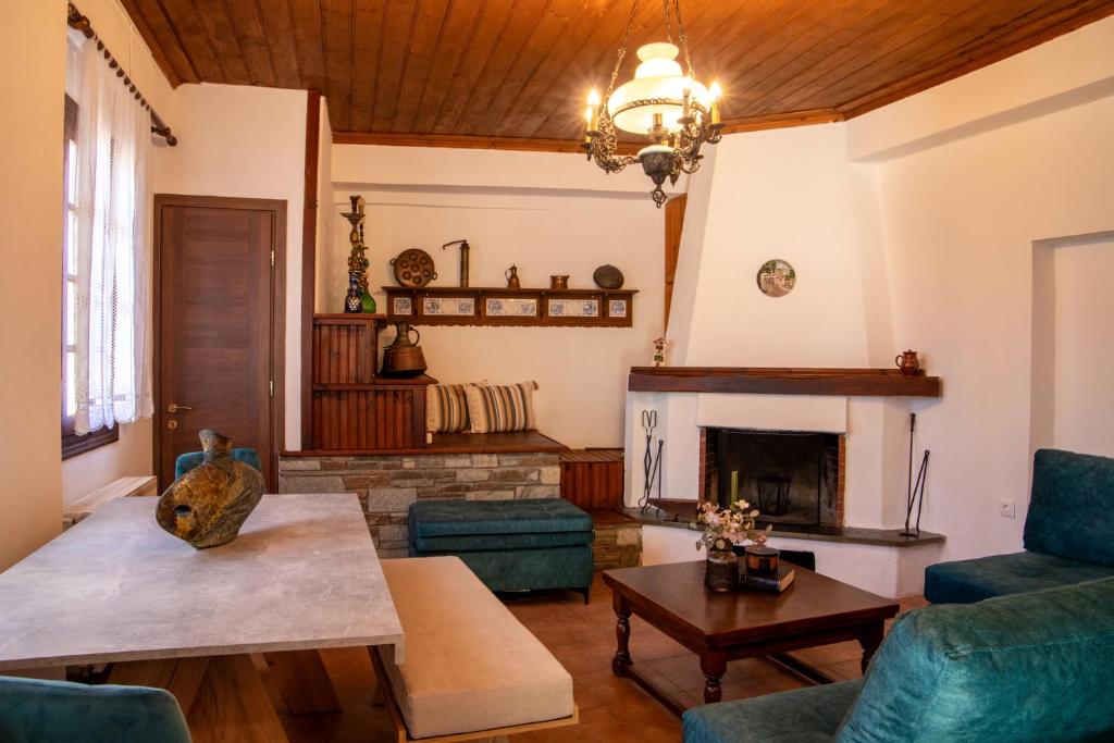 a living room with a couch and a fireplace at Portaria Heritage House in Portaria