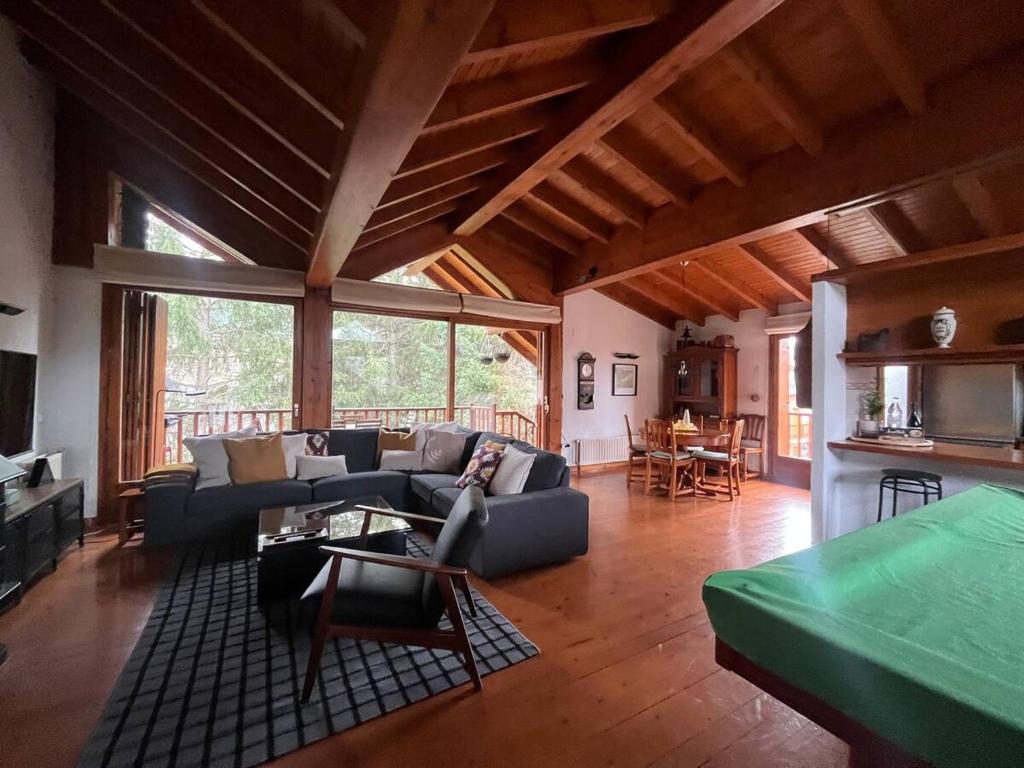 a living room with a couch and a table at New listing! House with pool and garden, Urús in Urus