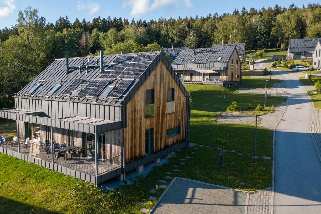 an overhead view of a house with solar panels on it at Lipno Verde in Lipno nad Vltavou