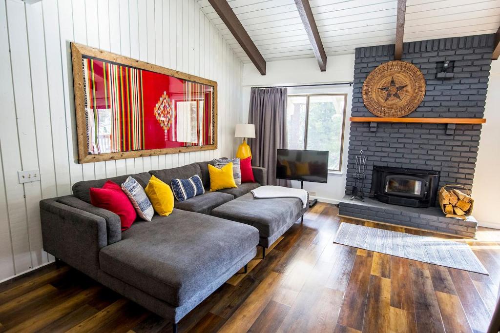 a living room with a couch and a fireplace at Mammoth's Best Location! 2BRLoft by Canyon Lodge in Mammoth Lakes