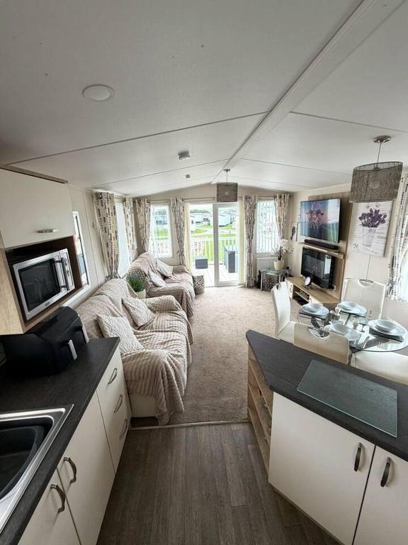 a large living room with a camper at Coastal Escape Bude Resort in Bude