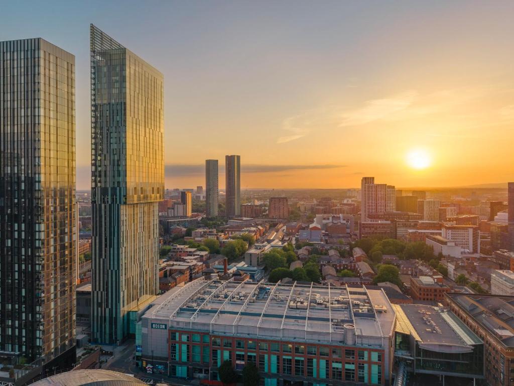 an aerial view of a city with skyscrapers at The Manchester Deansgate Hotel, by IHG in Manchester