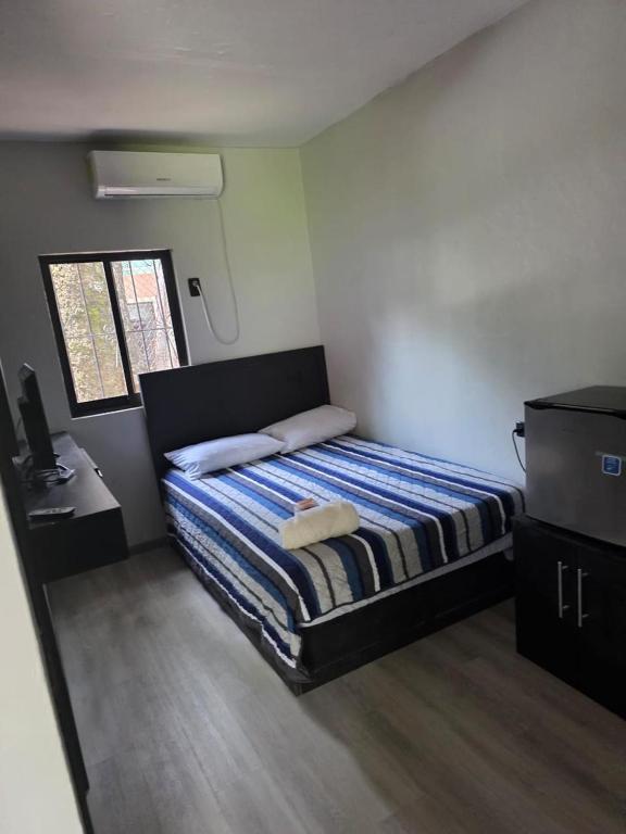 Postel nebo postele na pokoji v ubytování Hotel mg