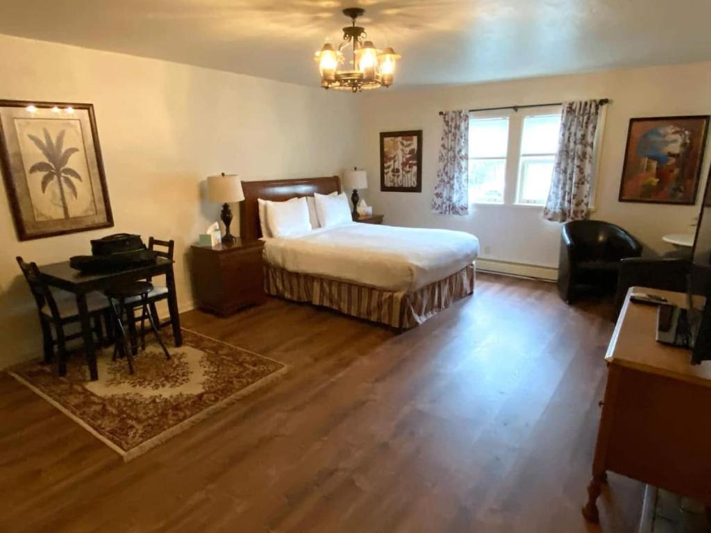 a bedroom with a bed and a table and a desk at Spacious Private Suite ParksBoatingGolf in San Francisco