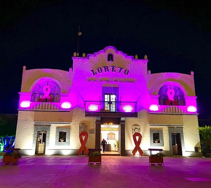 a building with pink lights in front of it at Stunning home - Amazing Mountain Views in Loreto
