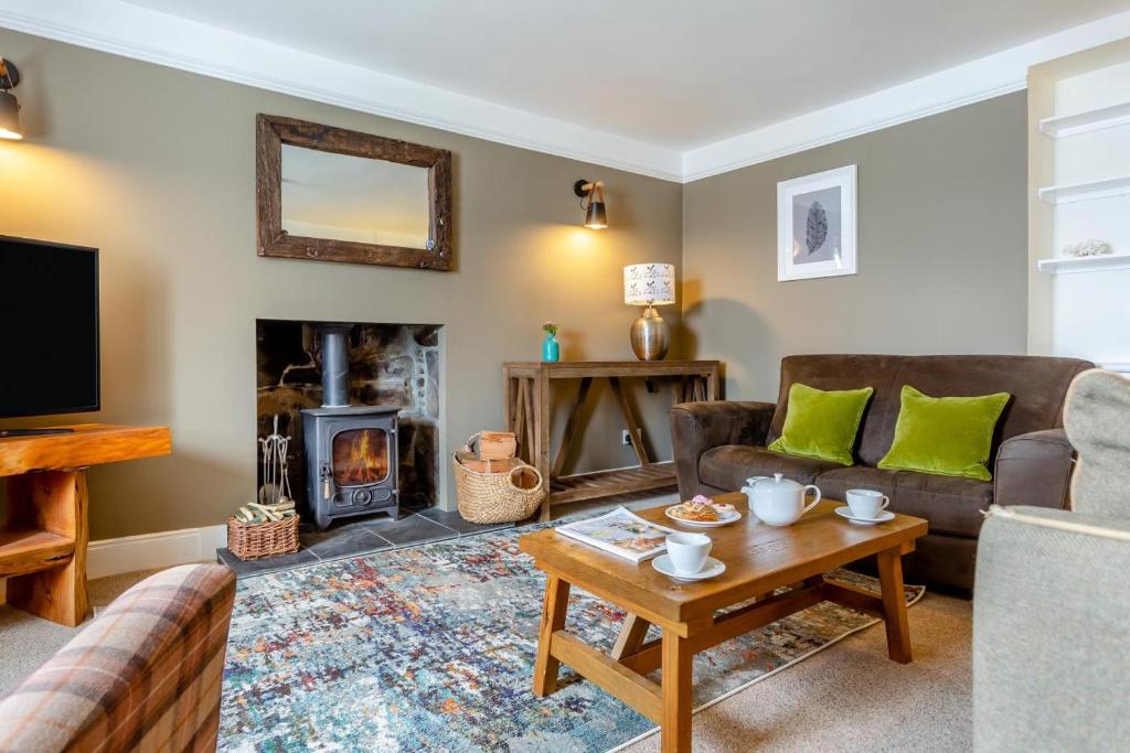 a living room with a couch and a fireplace at 2 Bed in Strath oc-s44223 in Gairloch