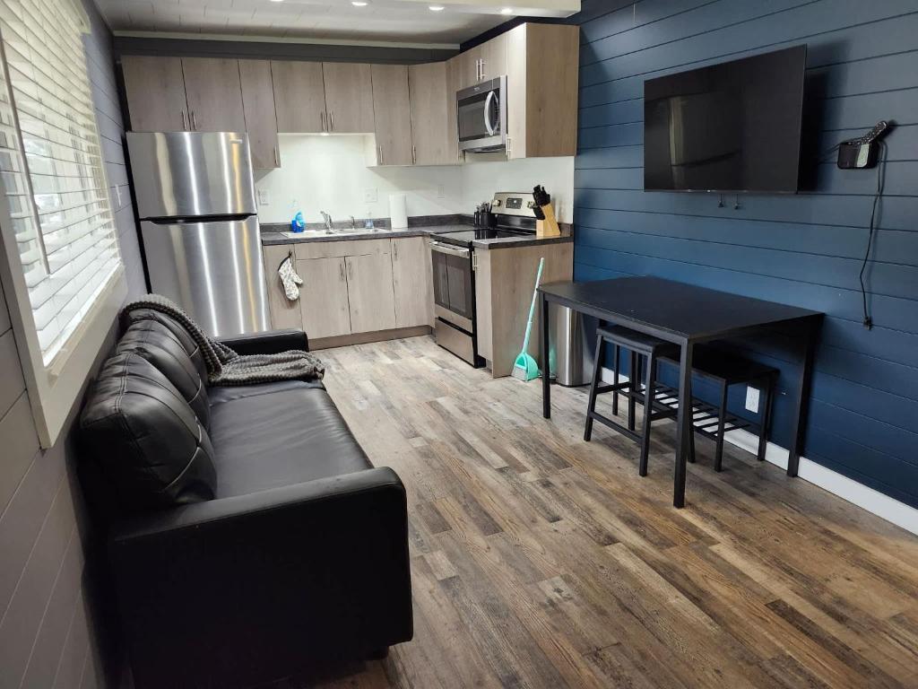a living room with a couch and a table in a kitchen at TeePee Room 17- Full Kitchen in Roscommon