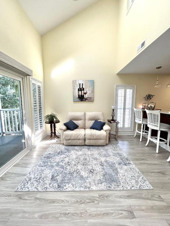 a living room with a couch and a table at Birdies Rest in Little River