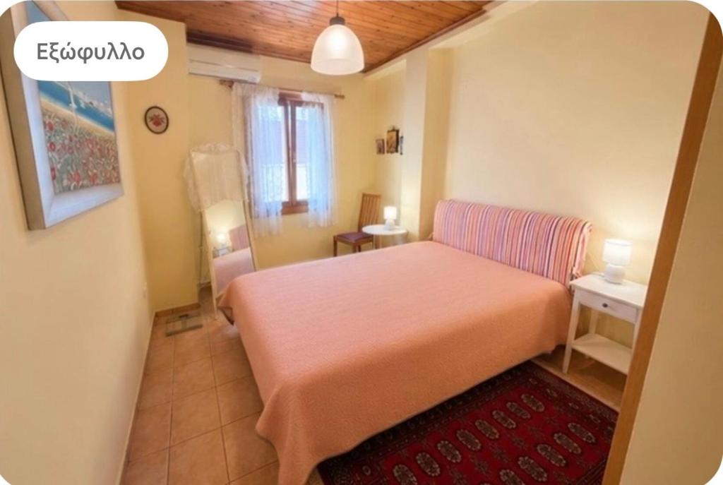 a small bedroom with a bed and a red rug at Like a local in Chios Castle in Chios